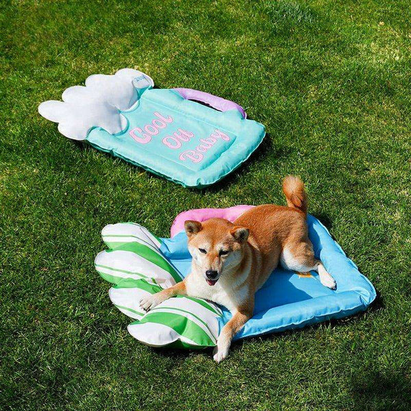 Portable pet cooling mat with handle design for outdoor activities.