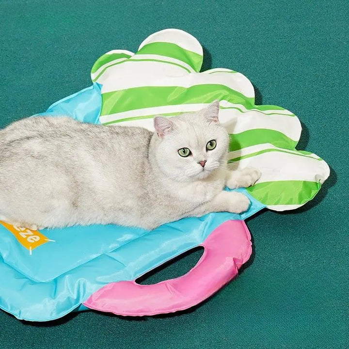 Portable pet cooling mat with handle design for outdoor activities.