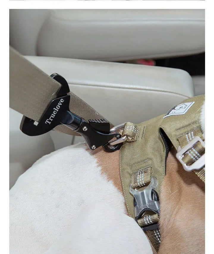 n aviation-grade aluminum seat belt for dogs, designed to ensure pet safety during car rides. The belt is clipped onto a car seat belt, connecting securely to the dog's harness. It features adjustable length for comfort, compatibility with various car models, and comes in multiple colors, providing both security and style for pet owners.