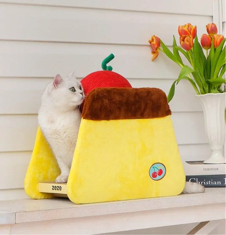 Cherry Cake Cat Bed - A cozy and stylish cat bed with a unique cherry cake design. Features a soft dome cover, replaceable scratch board, and cherry-shaped ball for play. Perfect for your cat's relaxation and fun.