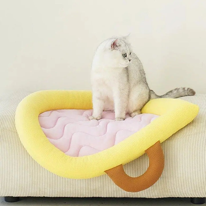 "Cooling cat mat with soft, breathable material for comfortable and cool pet resting.