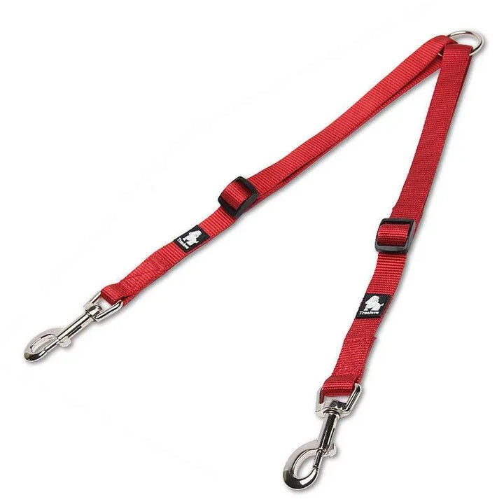 An image of a double dog leash with a tangle-free swivel mechanism. The leash features a soft, ergonomic foam handle and adjustable nylon straps in vibrant colors. Two sections of the leash branch out to allow walking two dogs simultaneously without tangling. Reflective stitching is visible for added safety in low-light conditions.