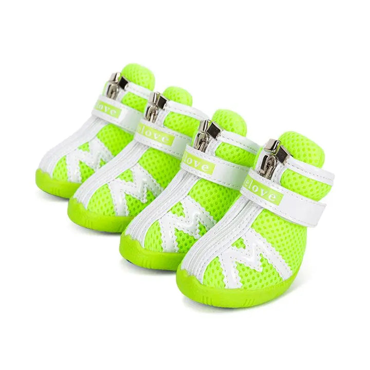 "Durable and stylish dog shoes in various colors, designed with breathable mesh and non-slip soles, perfect for protecting dogs' paws during outdoor activities."