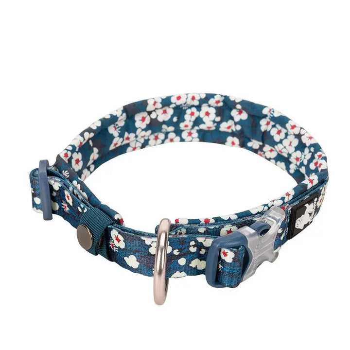 Floral dog collar with vibrant flower patterns, adjustable fit, and durable D-ring for leash attachment.