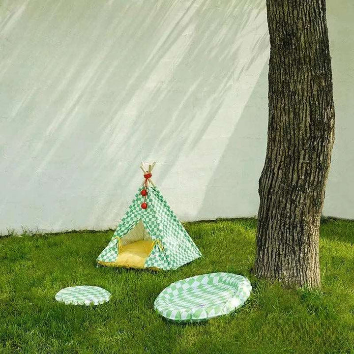 Cozy Cat Tent placed outdoors, used as an outdoor pet bed for cats to relax and enjoy the garden.