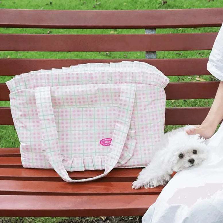 Plaid cat carrier bag with thick cushion, spacious interior, waterproof material, and side pockets for easy pet travel.