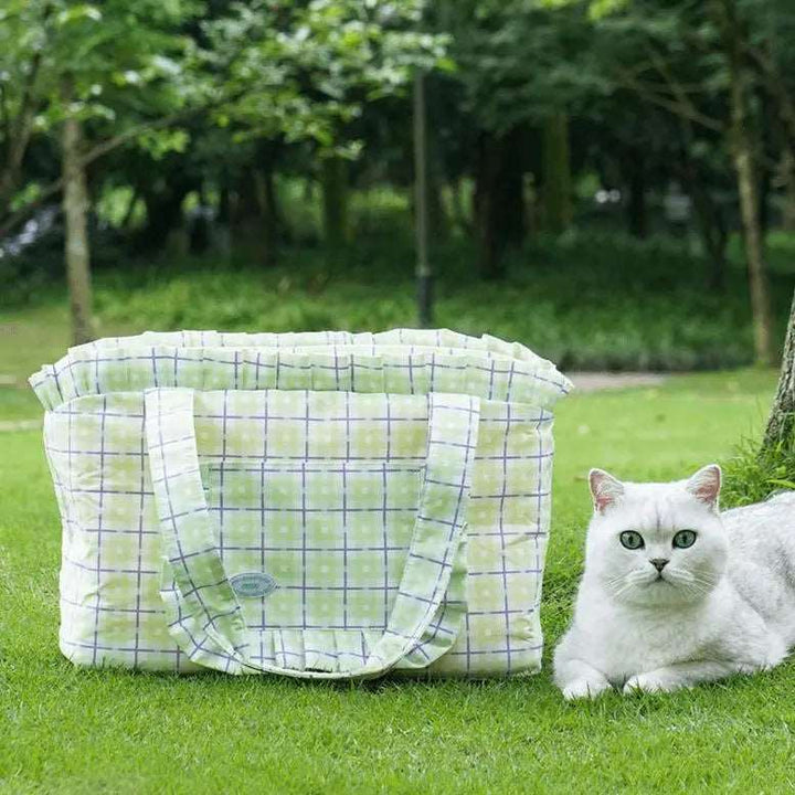 Plaid cat carrier bag with thick cushion, spacious interior, waterproof material, and side pockets for easy pet travel.