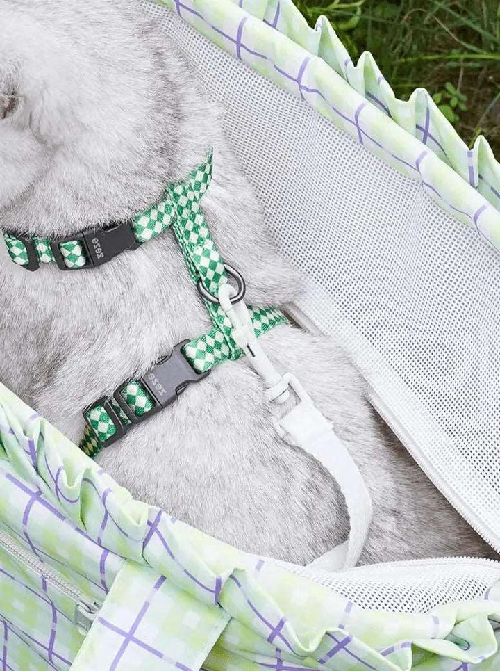 Plaid cat carrier bag with thick cushion, spacious interior, waterproof material, and side pockets for easy pet travel.