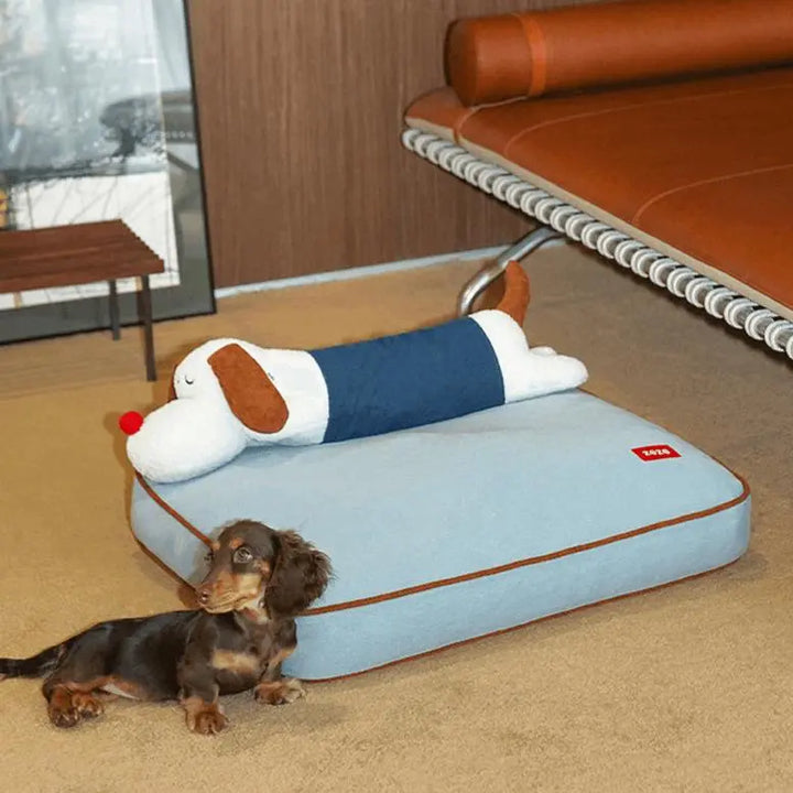 Cozy denim pet bed with a detachable puppy-shaped pillow, featuring a spacious design suitable for both dogs and cats. Made of soft-touch fabric, durable denim, and plush filling for comfort and support.