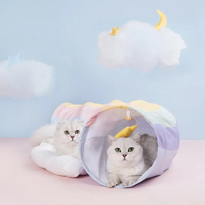 Colorful rainbow cat tunnel bed with hanging star toy and soft cushion, perfect for playful and comfortable cat relaxation.