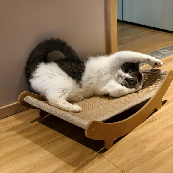 Cat lounging on a scratch pad with sisal surface, ideal for reducing furniture damage