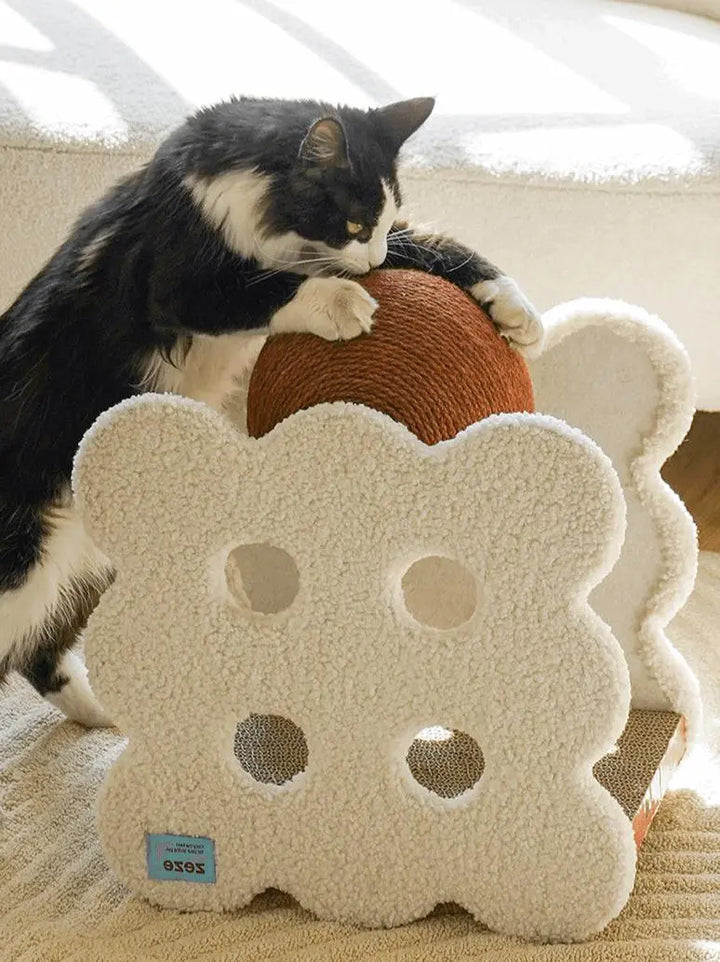 Sandwich Biscuit-shaped cat scratching ball made of plush fabric, hemp rope, and corrugated paper, in caramel and off-white.