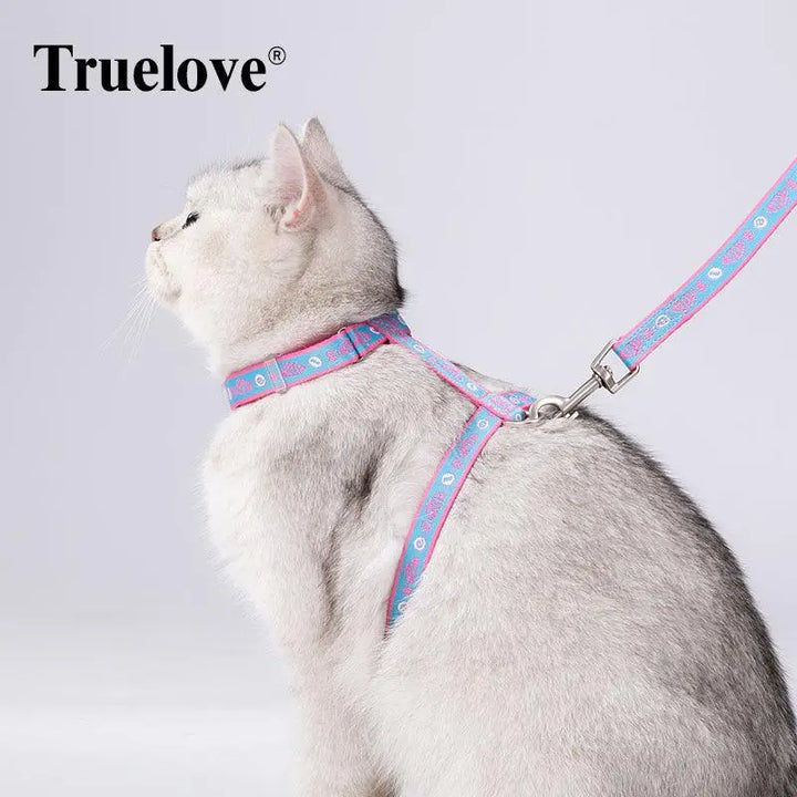 Truelove Cat Harness and Leash Set in vibrant colors with soft pattern webbing, adjustable zinc alloy buckle, and decorative bell, designed for secure and comfortable outdoor adventures.